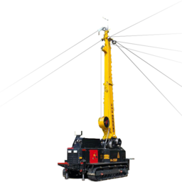 Rammmaschine im Einsatz Gelbe Rammmaschine mit ausgefahrenem Arm auf einer Baustelle