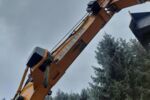 Kettenbagger LIEBHERR R920 mit WOODY WH6-1 mit Rückewinde